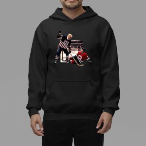 Trump Defeating Justin Trudeau Funny Hockey Hoodie